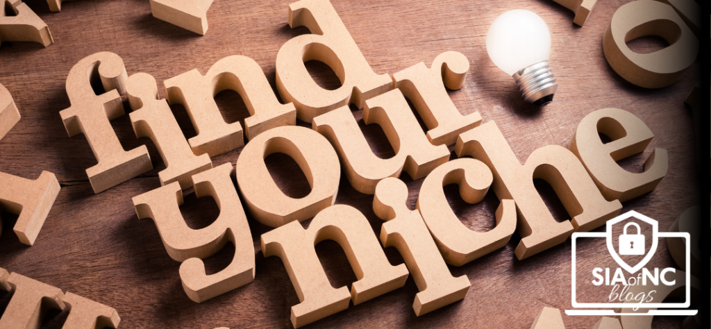 Wooden blocks on table spelling, "Find your Niche"